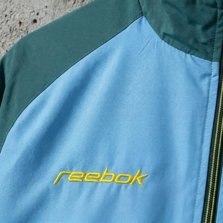 Casaco azul/verde leão 2026/27 fecho completo - corta vento