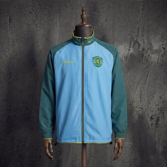 Casaco azul/verde leão 2026/27 fecho completo - corta vento